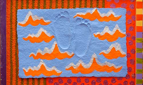 colorful artwork with orange waves and footprints on a blue background