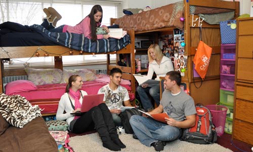 Photo of students studying in dorm room